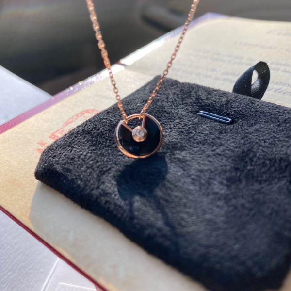 Ca*t*er amulet necklace