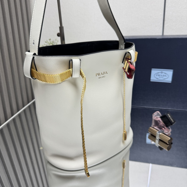 Pra*a buckle leather bucket bag with jeweled belt